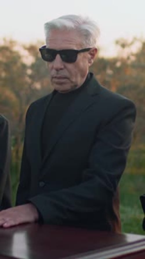 Man Speaks at Funeral Outdoors
