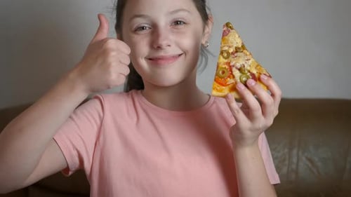 Happy Girl Holds Pizza and Gives Thumbs Up