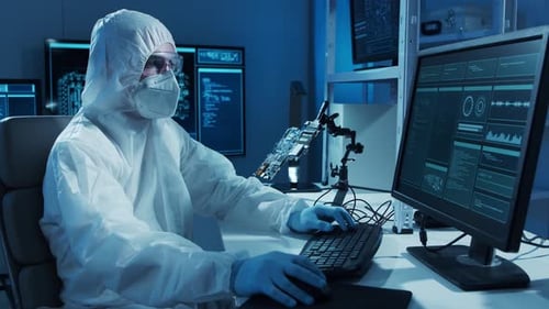 Microelectronics Engineer Works in a Modern Scientific Laboratory on Computing Systems and