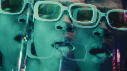 Kaleidoscopic Effect of Black Rapper Giving Hip-Hop Performance in Neon Lights