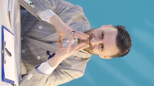 Vertical Video of Successful businessman folds his arms. Confident businessman portrait.