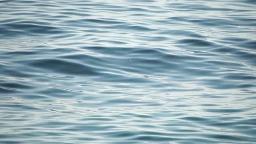 Sea Water Surface Low Angle View Over Clear Azure Sea Water Sun Glare Abstract Nautical Summer Ocean