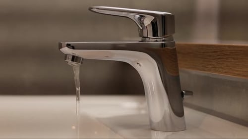 Running Faucet in Clean Modern Home