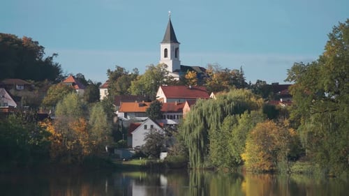St. Sebastian's and Fabian's Church in Prague stands above the pond surrounded by greenery and small