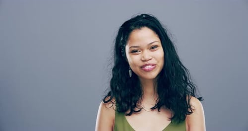 Smiling Woman Making Heart Shape with Hands