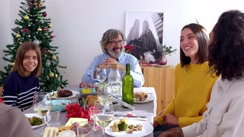 Family Celebrates Christmas with Festive Dinner at Home