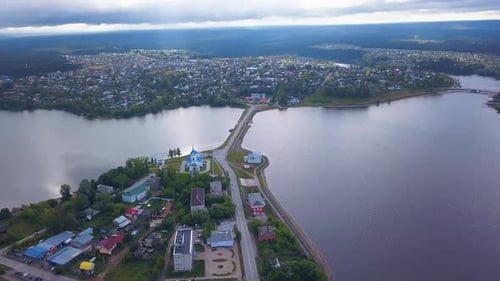 Top view of road across river in town