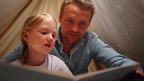 Father and Daughter Reading Story Together
