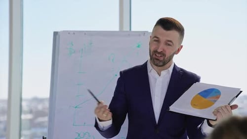 Man Presenting Business Information at a Meeting