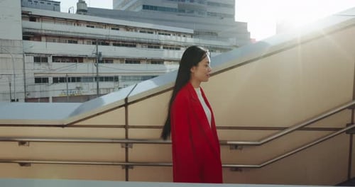 Japanese, woman on stairs and travel in city with sunshine, walking outdoor with buildings