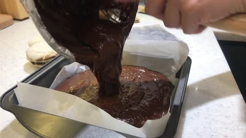 Pouring Delicious Chocolate Batter Into Baking Tray