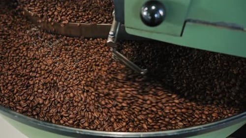Coffee Beans Being Roasted in a Rotating Machine
