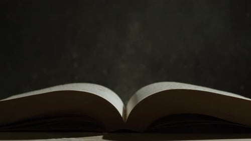 Open Book with Floating Dust Particles