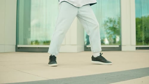 Young Adult Dancing Outdoors in Casual Style