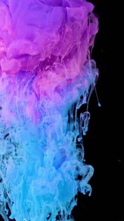 Swirling Pink and Blue Ink on Black Background