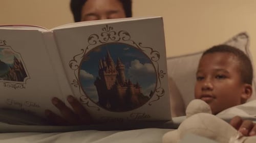 Grandma Reading Fairy Tales to Grandkids in Bed