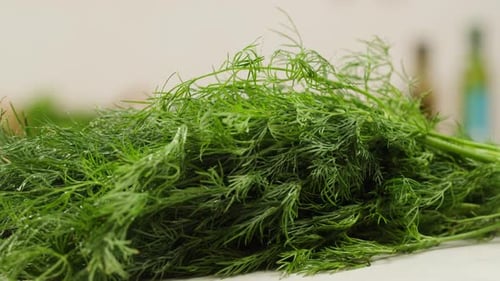 Cutting Dill Chef Cut Dill with Knife on a Wooden Board Close Up at Home Vitamin Vegan Greens