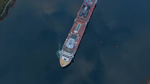 Cruise liner seen from above, gliding through calm ocean