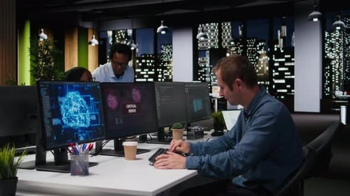Software Developer in Office Receiving Critical Error Warning