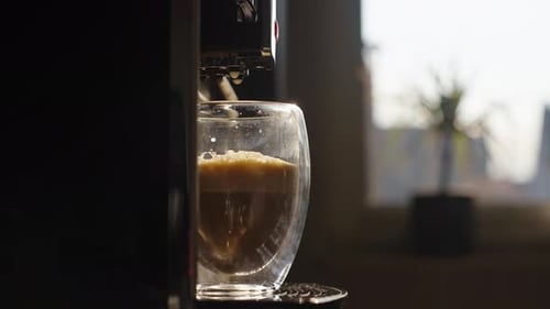 Espresso Being Dispensed into a Glass