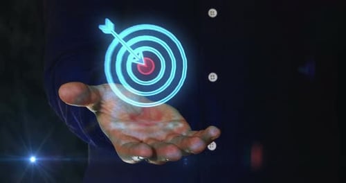 Target business strategy symbol over hand