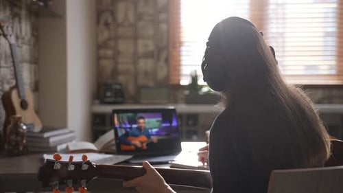 Student Learns Guitar Online at Home