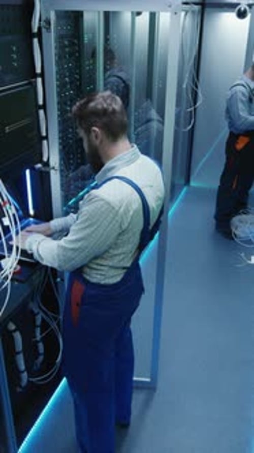 Top View People Work in the Data Center in the Server Room