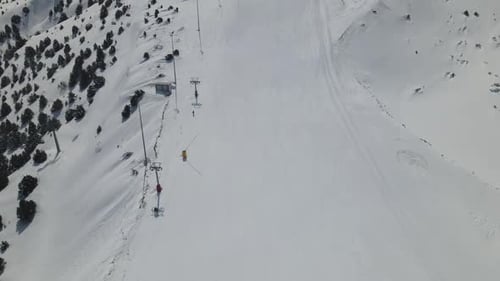 Aerial View of Skiers on Snowy Mountain Slope