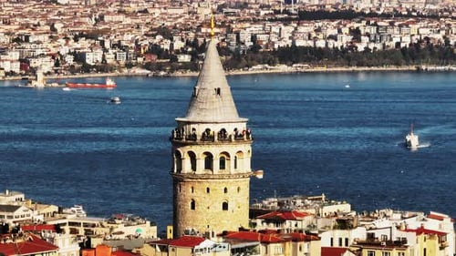 People on Observation Gallery of Old Tourist Sight Aerial Descending Footage of Galata Tower Against