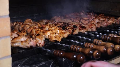 Closeup of a Chef Frying a Barbecue in a Restaurant Kitchen