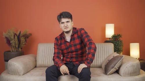Man looking negative at camera.