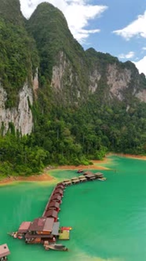 Tropical Lake with Floating Bungalows Aerial View