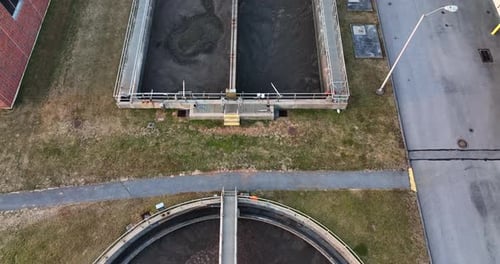 Aerial sewage treatment water purification plant. Tilt up reveal.