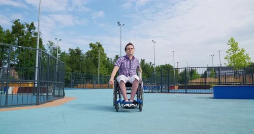 Man in Wheelchair Navigating Recreation Area