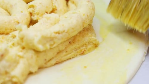 pastry chef cooks the famous king cake.close up of hands in gloves,