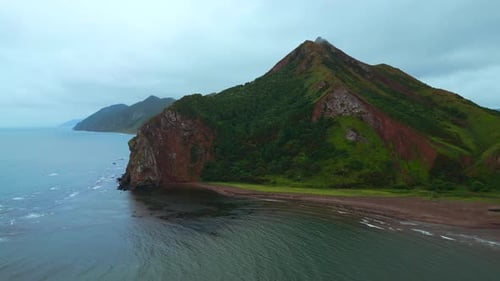 Top view of amazing landscape of mountain coast on cloudy day. Clip. Cinematic landscape of coast