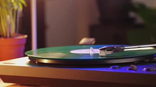 Green Vinyl Record Spinning on Turntable