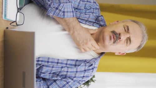 Vertical video of Old man with sore throat.