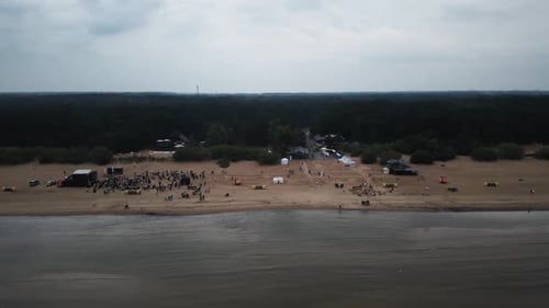 Aerial drone view of a party in sea beatch.