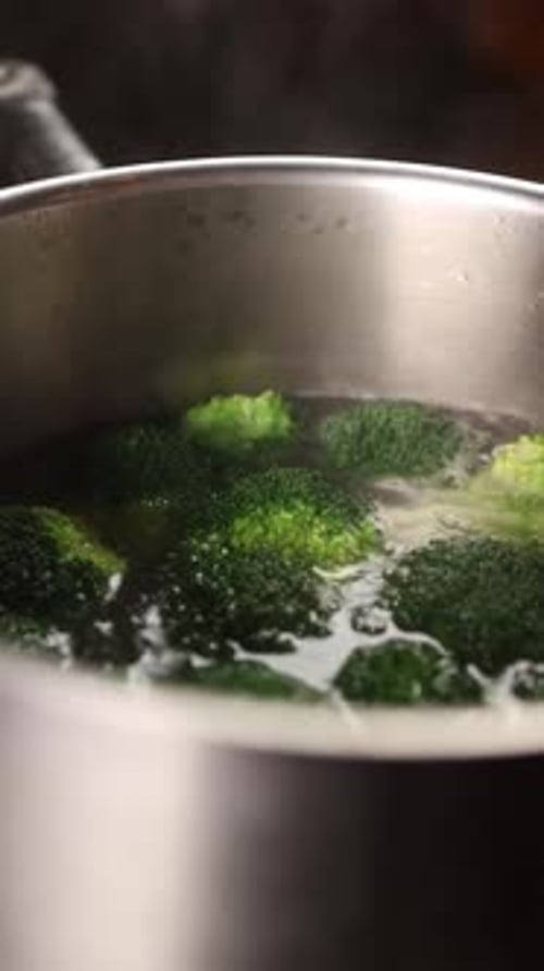 The chef prepares a vegetable dish. Cooking broccoli