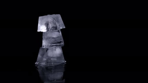 Three Ice Cubes Stacked on Black Background