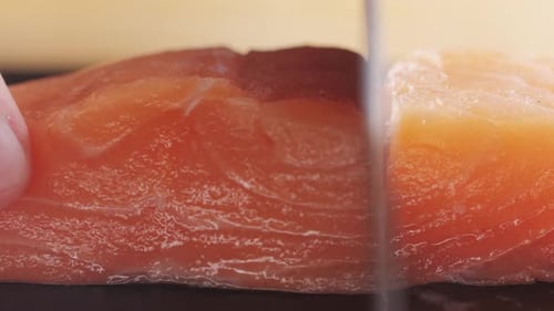 Sushi Chef Slices Fresh Raw Salmon on Professional Kitchen Close Up Chef Cooking Tartare Cutting