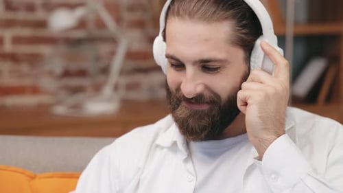 Young Man Listening to Music with Headphones