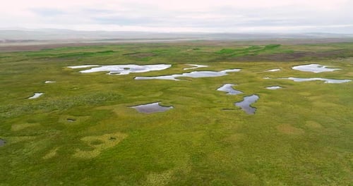 Aerial view of ponds and grassland in the highlands of Iceland.