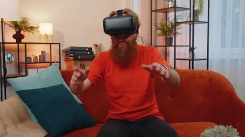 Man Playing Video Game with VR Headset at Home