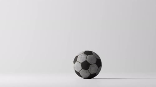 Worn Soccer Ball Rolls to Frame Edge
