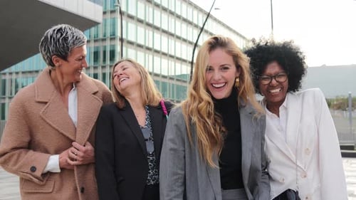 Diverse Group of Smiling Businesswomen Laughing Together
