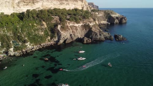 Aerial View of Beachside Cliffs and Turquoise Water
