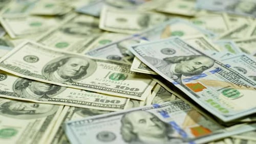 Dollars are on the Table Symbolizing the Influence of the Currency Economy