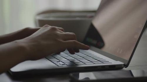 Hands Typing on Keyboard Close Up